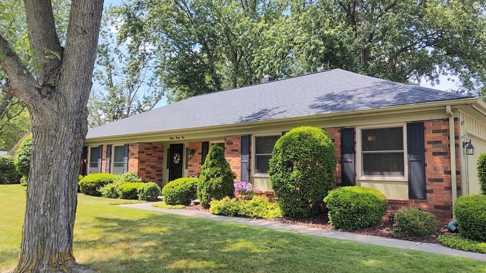 Brick ranch home with roof replacement by Gean Roofing